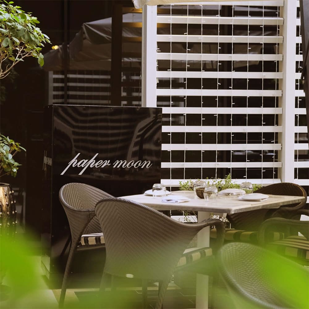 Elegant dining room at Paper Moon Doha with modern Italian interior design Elegant dining room at Paper Moon Doha with modern Italian interior design