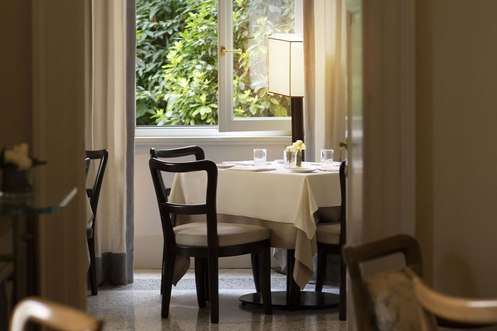 Evening view of the garden lounge at Paper Moon Giardino