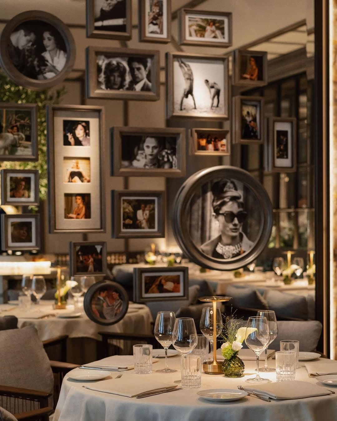 Elegant dining area with warm lighting and contemporary décor at Paper Moon London Elegant dining area with warm lighting and contemporary décor at Paper Moon London